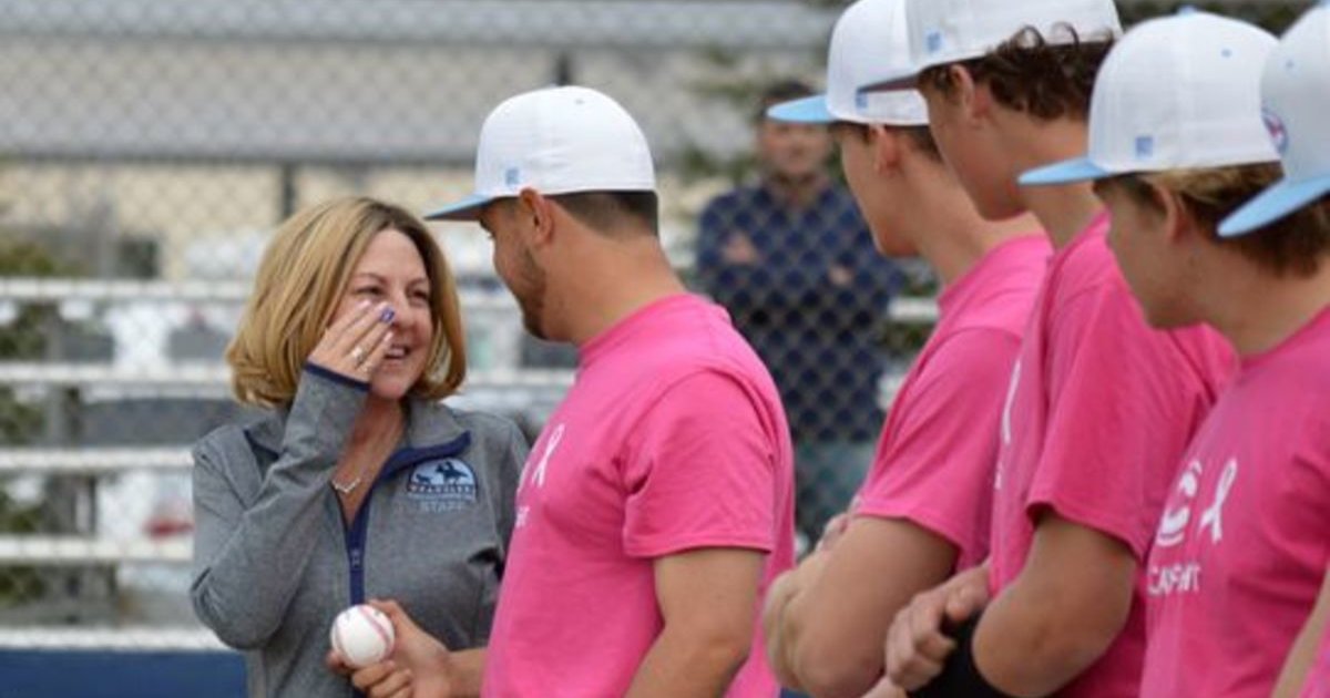 A Group Of High School Baseball Players Rally Around Their Coach's 51 ...