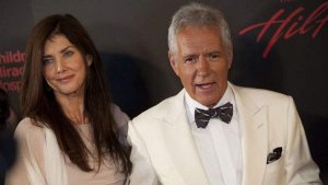Alex and Jean Trebek both wearing white at an event