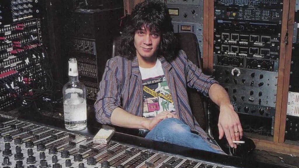 Eddie Van Halen in a music studio next to a bottle of alcohol