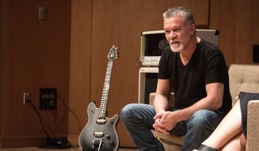 Eddie Van Halen sitting on a couch during an interview