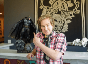 Val Kilmer posing in front of a batman figurine on his instagram 