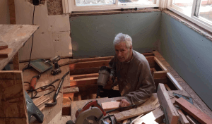 Alex Trebek pictured remodeling Jean Trebek's bathroom with many tools