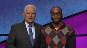 Alex Trebek poses with "Jeopardy!" contestant Terry Heard, Jr.