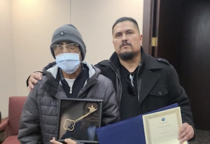 Guzman (above with his son) received a key to the town as a thanks for all he has done over the years.
