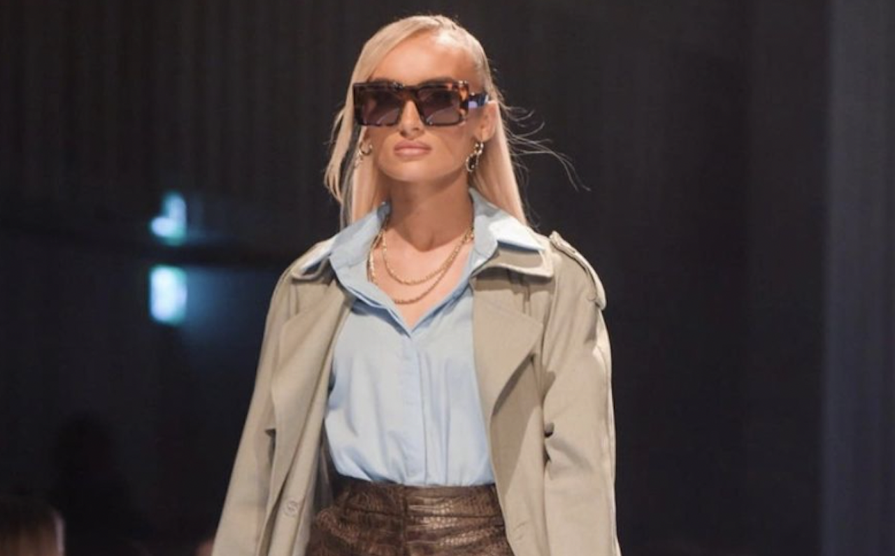 A model, sunglasses detail, walks the runway at the Fendi show