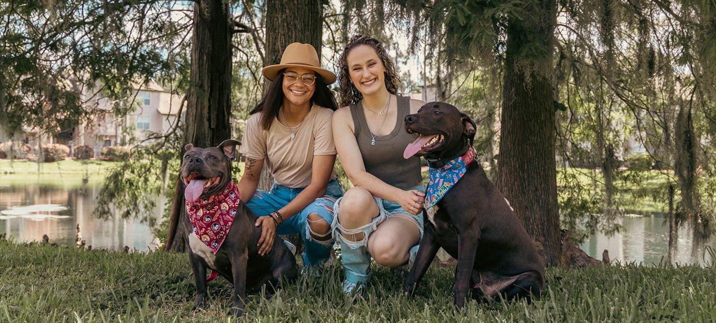 Emily Rozen with her girlfriend and two dogs.