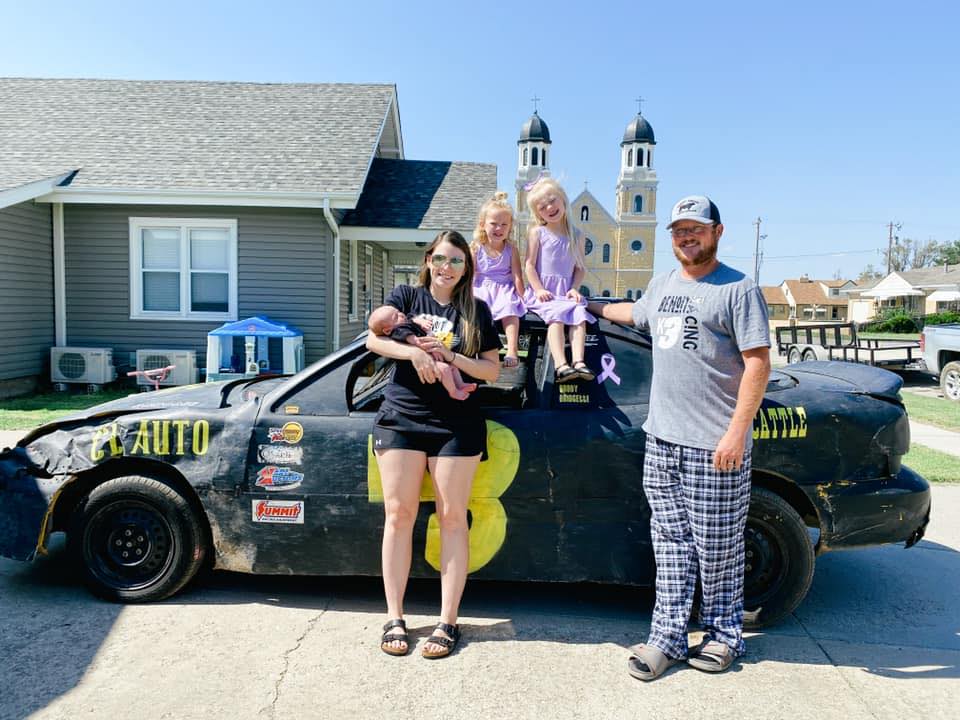 Kyle and Justine Benoit with their three kids.