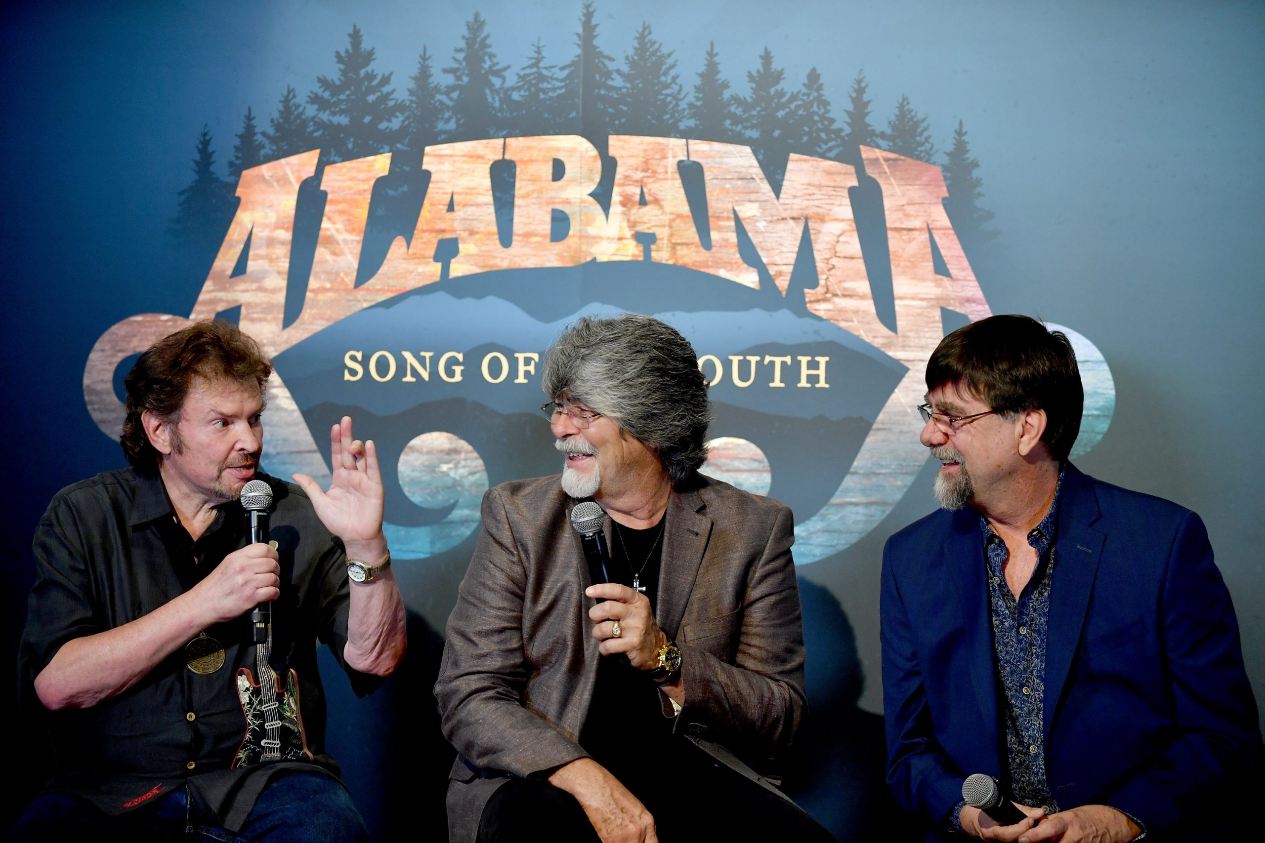 NASHVILLE, TN - AUGUST 22:  (L-R) Jeff Cook, Randy Owen, and Teddy Gentry of the band Alabama speak during the debut of the "Alabama: Song of the South" exhibition at Country Music Hall of Fame and Museum on August 22, 2016 in Nashville, Tennessee.  (Photo by Jason Davis/Getty Images for Country Music Hall of Fame & Museum)